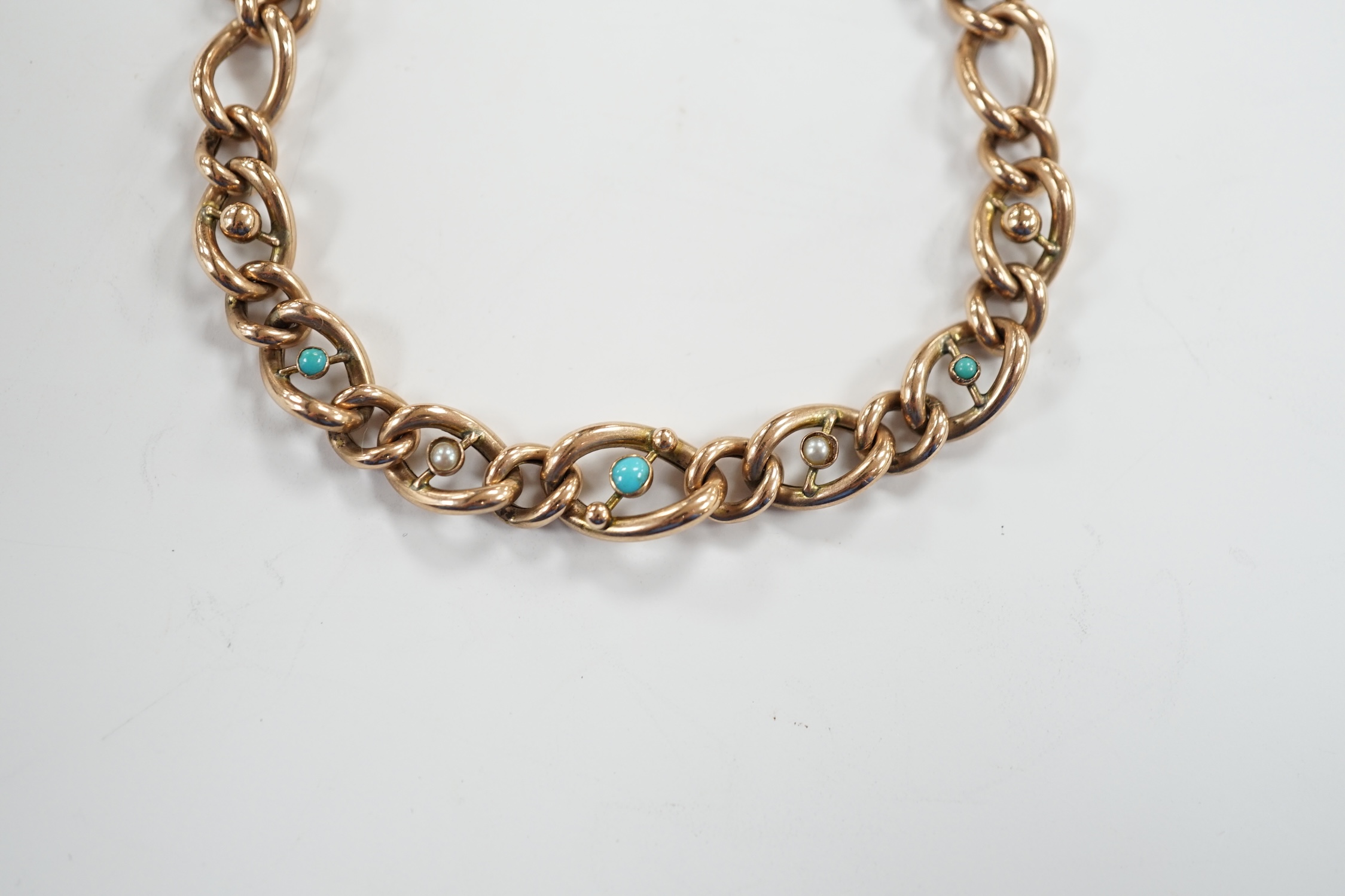 A 9ct gold and turquoise bead set curb link bracelet, with heart shape padlock clasp, 18cm, gross weight 11.2 grams.